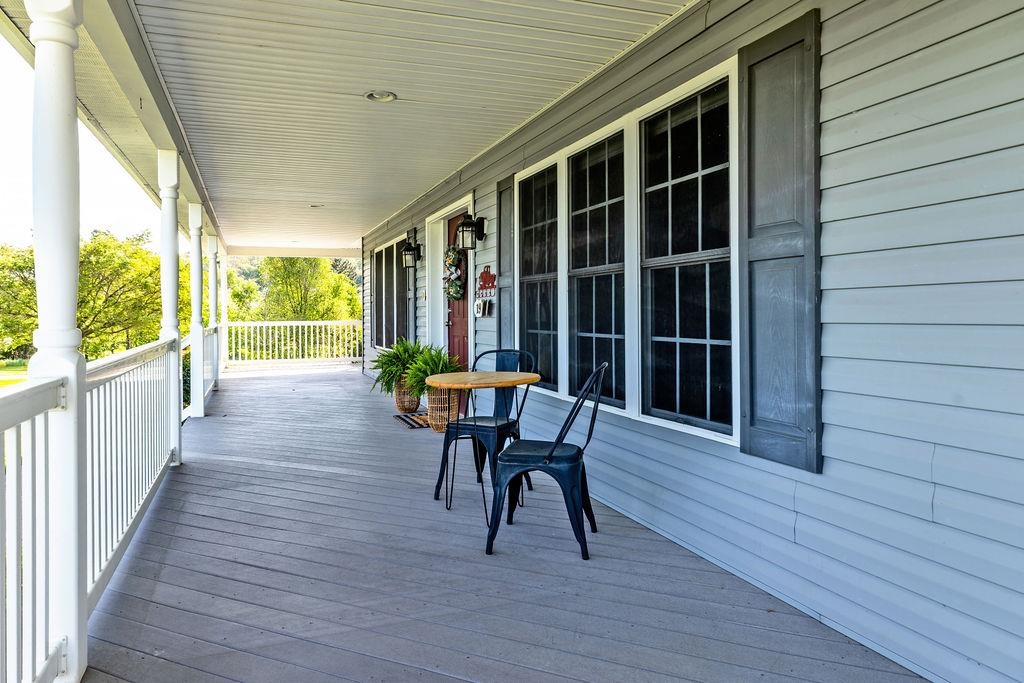 1916 Tinkling Spring Road Stuarts Draft, VA 24477 - Photo 4 of 66 a view of a deck with wooden floor and outdoor seating