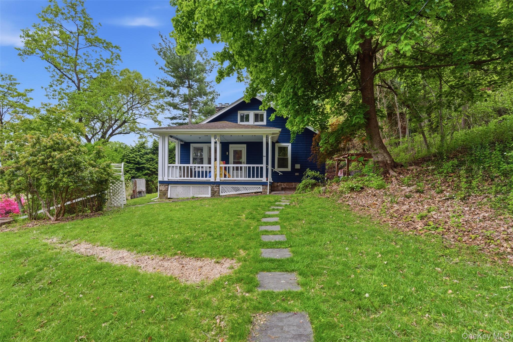 988 Rte 9W Nyack, NY 10960 - Photo 1 of 24 a front view of a house with a yard and green space