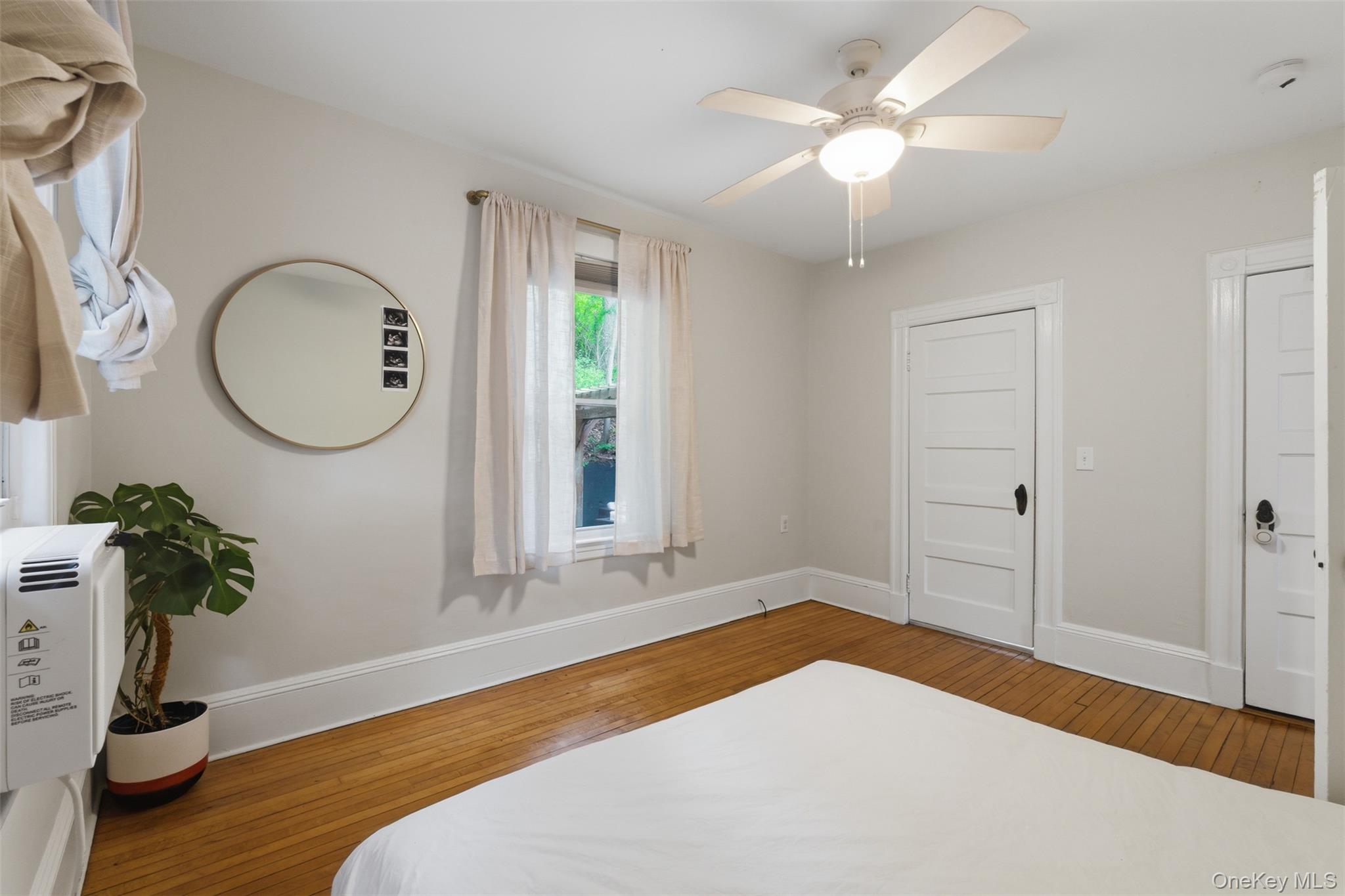 988 Rte 9W Nyack, NY 10960 - Photo 12 of 24 a bedroom with a bed dresser and a window