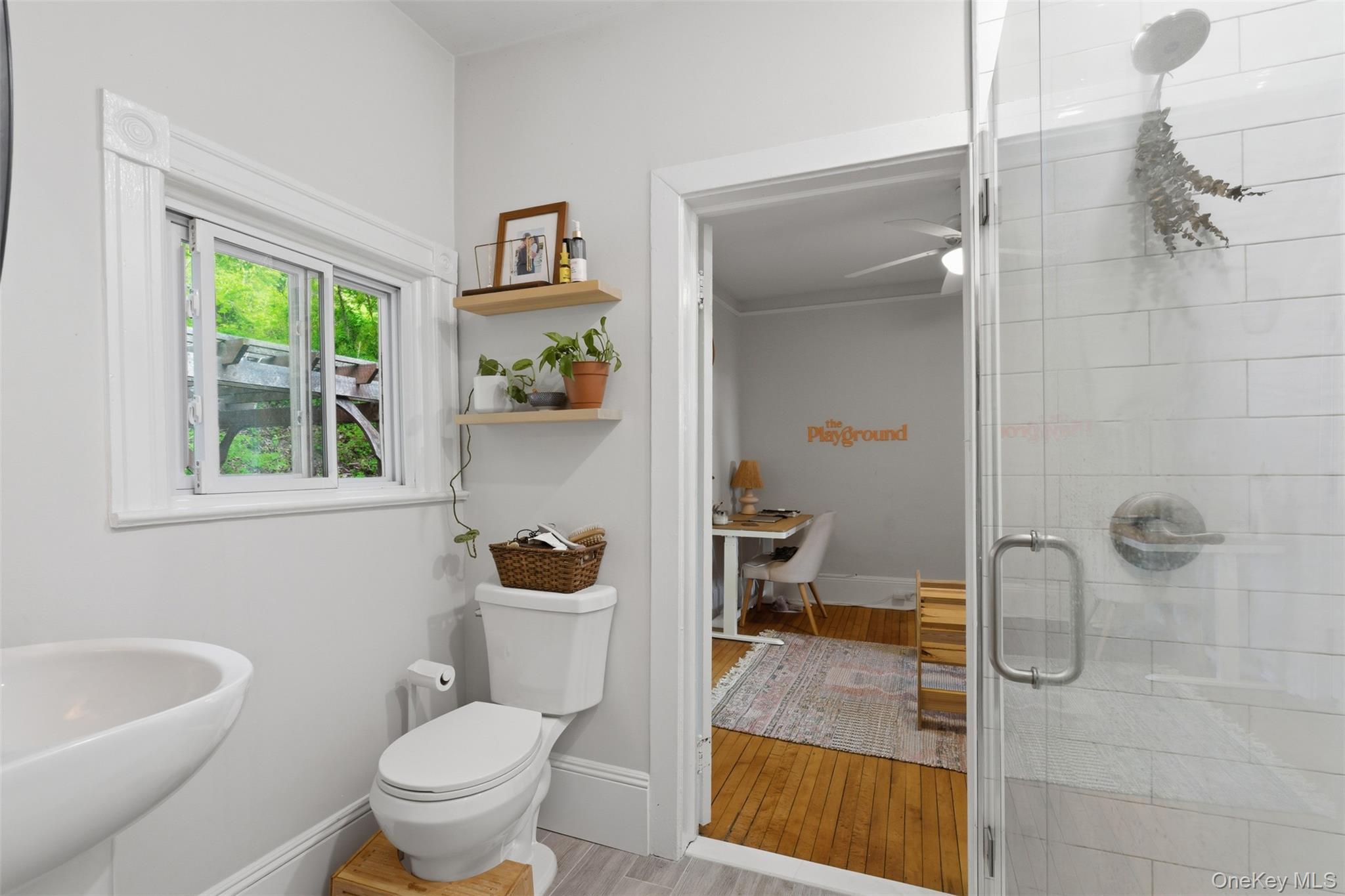 988 Rte 9W Nyack, NY 10960 - Photo 13 of 24 a bathroom with a granite countertop toilet a sink and a shower