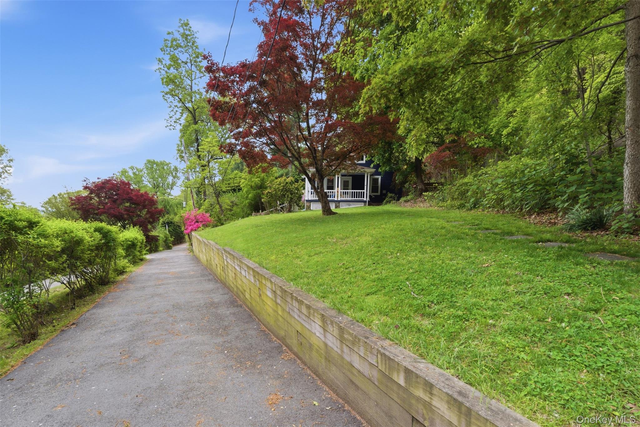 988 Rte 9W Nyack, NY 10960 - Photo 20 of 24 a view of a garden with a bench