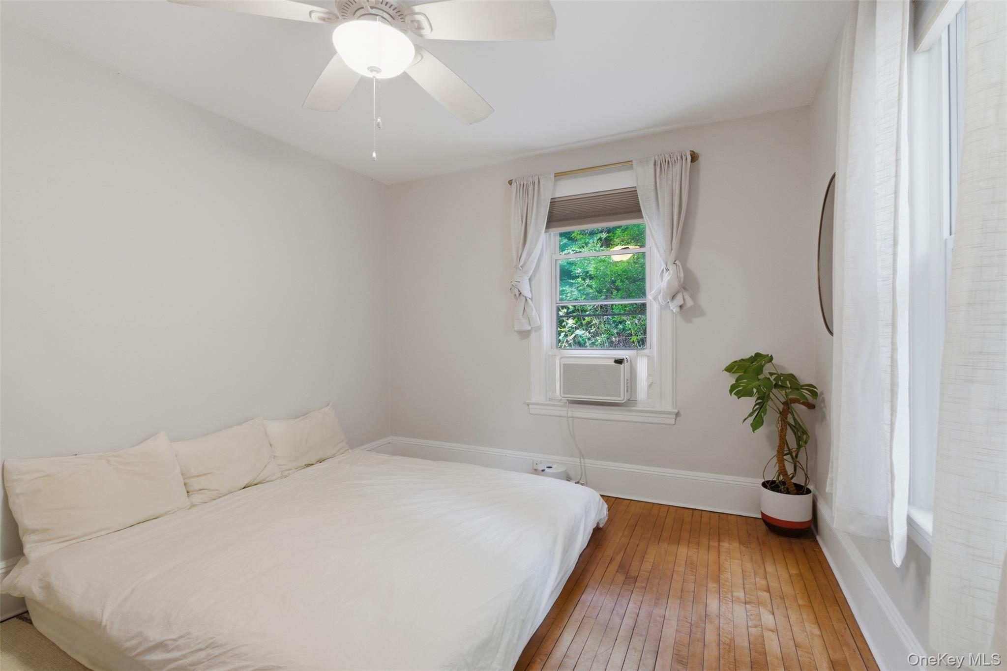 988 Rte 9W Nyack, NY 10960 - Photo 10 of 24 a bed sitting in a bedroom next to a window