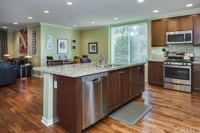 533 Rockefeller Irvine, CA 92612 - Photo 1 of 1 Goumet Kitchen with European Cabinetry / Slab Granite-Counter Tops with Stainless Steel Appliances, Mohwak Hardwood Flooring, Crwon Modling and Custom Paint