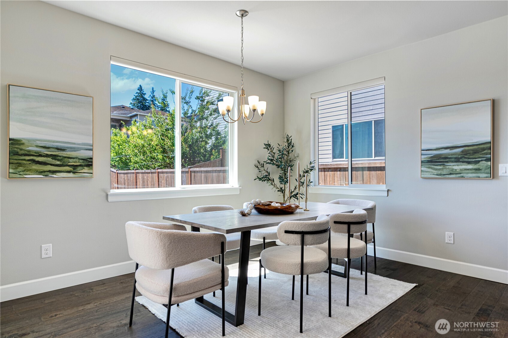 310 181st Street Southeast Bothell, WA 98012 - Photo 8 of 25 a view of a dining room with furniture window and wooden floor