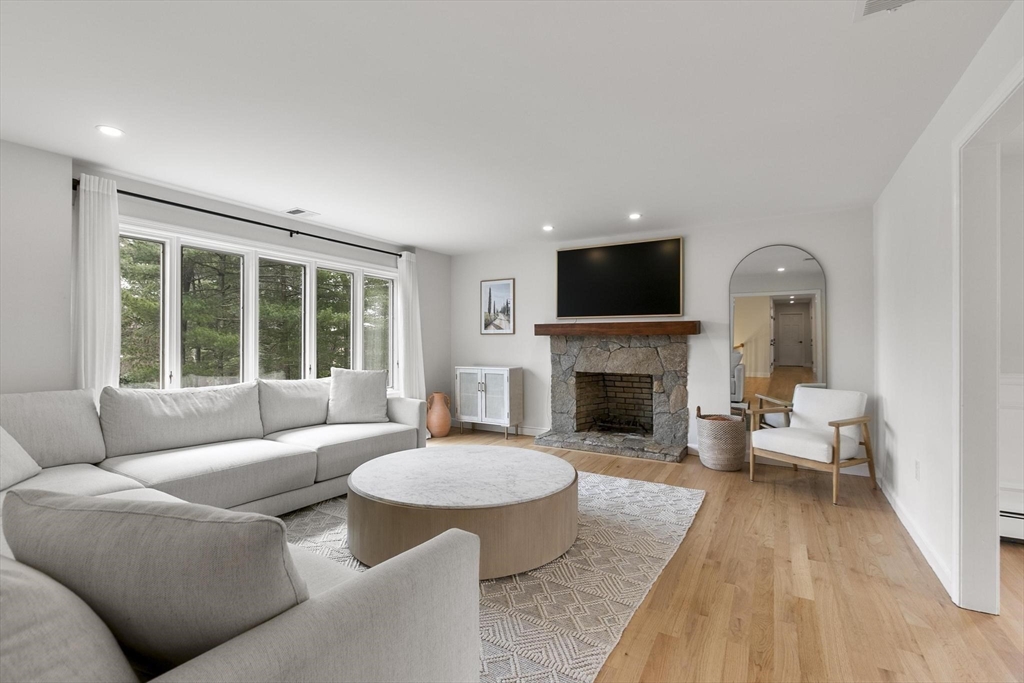 5 Crestwood Road North Reading, MA 01864 - Photo 12 of 40 a living room with furniture and a fireplace