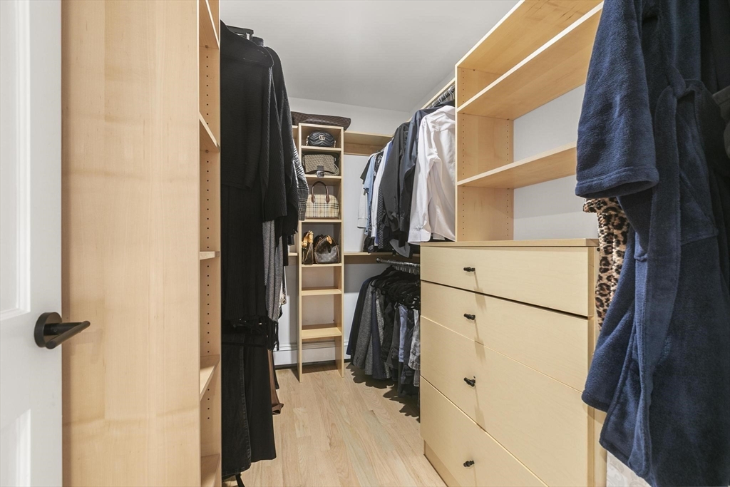 5 Crestwood Road North Reading, MA 01864 - Photo 16 of 40 a view of walk in closet with clothes and shoes