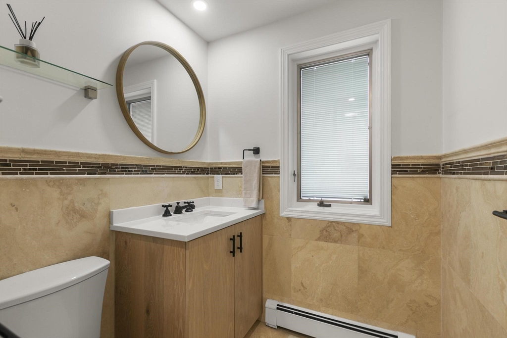 5 Crestwood Road North Reading, MA 01864 - Photo 18 of 40 a bathroom with a sink a toilet and a mirror