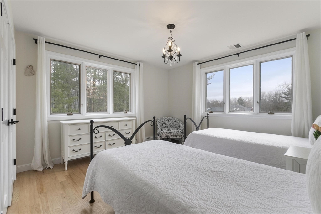 5 Crestwood Road North Reading, MA 01864 - Photo 19 of 40 a bedroom with a large bed and a window