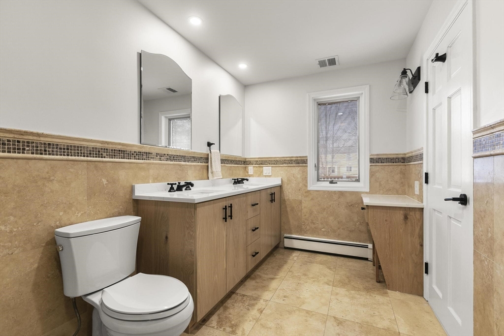 5 Crestwood Road North Reading, MA 01864 - Photo 21 of 40 a bathroom with a toilet sink and mirror