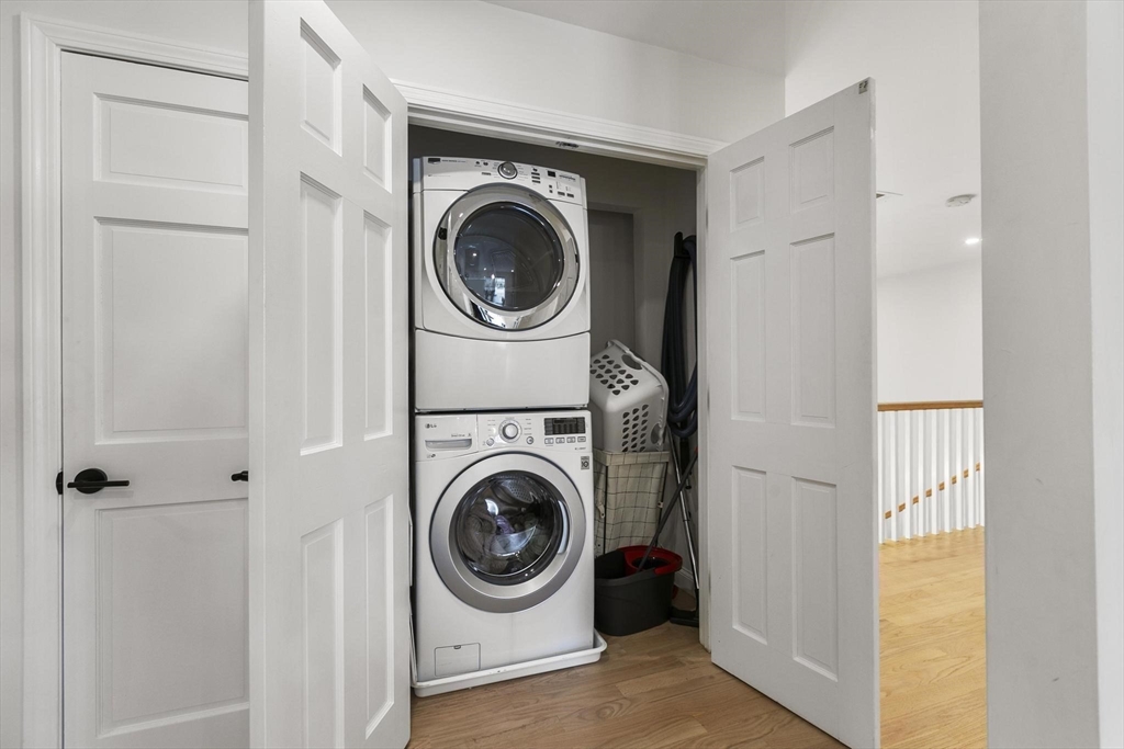 5 Crestwood Road North Reading, MA 01864 - Photo 23 of 40 a view of a hallway with washer and dryer