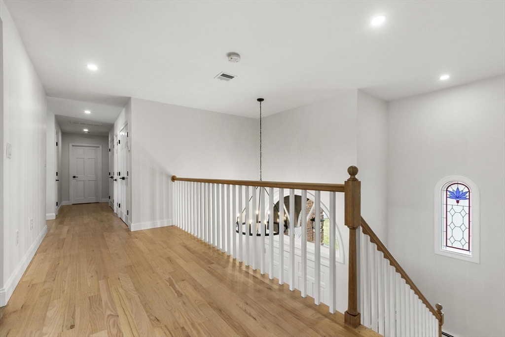 5 Crestwood Road North Reading, MA 01864 - Photo 24 of 40 a view of a hallway with wooden floor