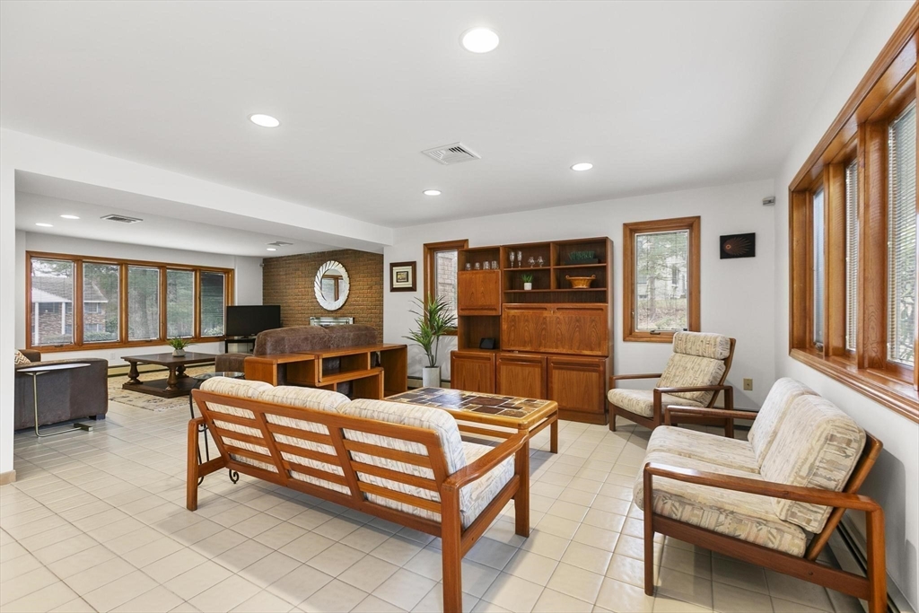 5 Crestwood Road North Reading, MA 01864 - Photo 25 of 40 a living room with fireplace furniture and a window