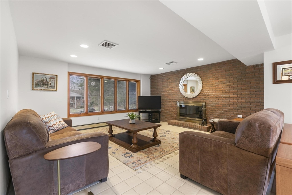 5 Crestwood Road North Reading, MA 01864 - Photo 27 of 40 a living room with fireplace furniture and a large window