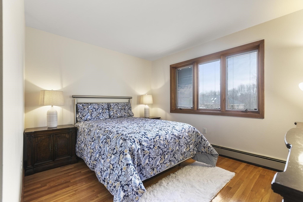 5 Crestwood Road North Reading, MA 01864 - Photo 30 of 40 a bedroom with a bed and a window