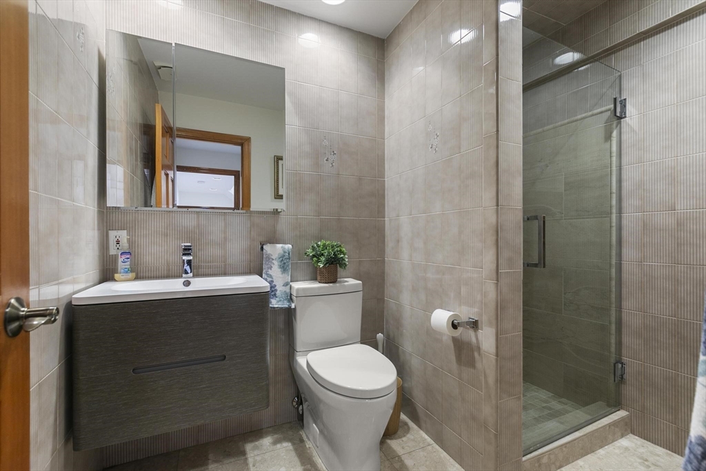 5 Crestwood Road North Reading, MA 01864 - Photo 31 of 40 a bathroom with a sink toilet and shower