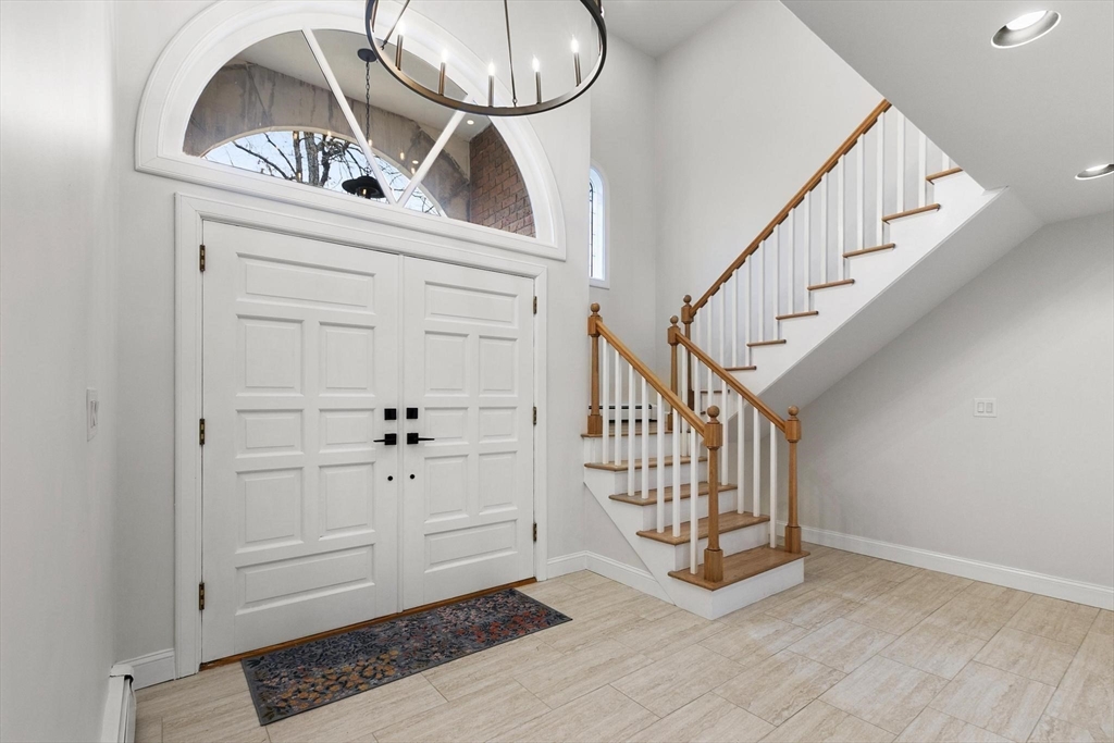 5 Crestwood Road North Reading, MA 01864 - Photo 33 of 40 a view of a livingroom with wooden floor and a staircase