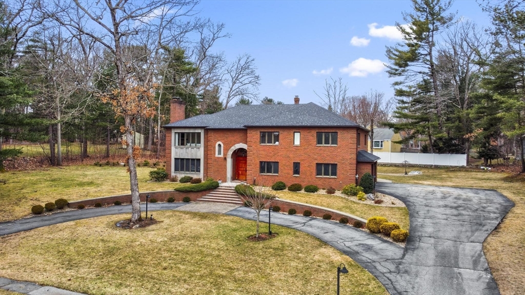 5 Crestwood Road North Reading, MA 01864 - Photo 4 of 40 a swimming pool covered with buildings in the background
