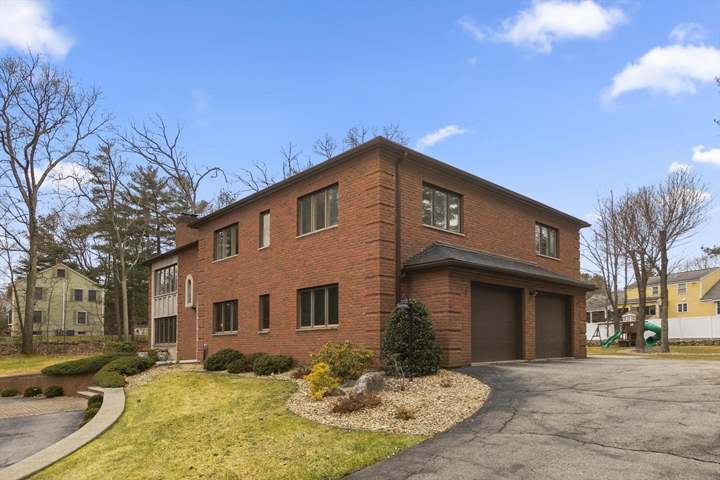 5 Crestwood Road North Reading, MA 01864 - Photo 5 of 40 a front view of a house with a yard