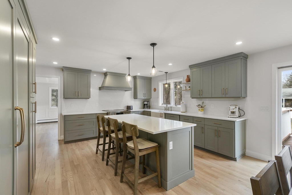 5 Crestwood Road North Reading, MA 01864 - Photo 6 of 40 a large kitchen with a table and chairs