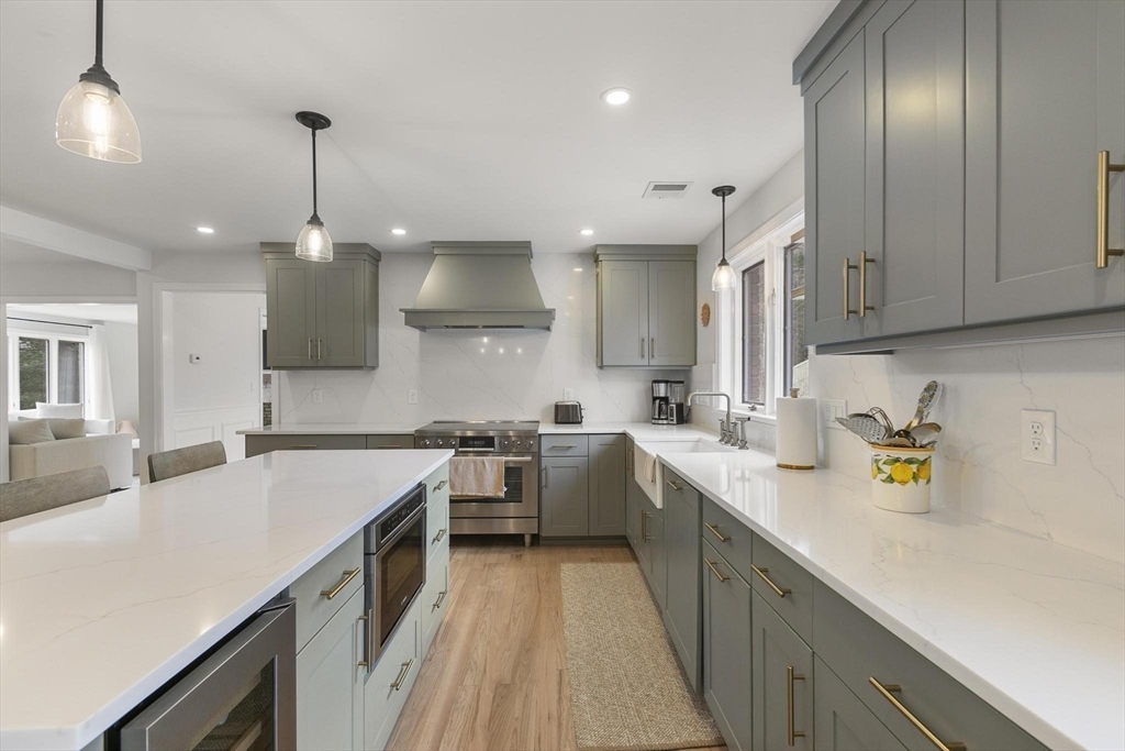 5 Crestwood Road North Reading, MA 01864 - Photo 7 of 40 a kitchen with a sink a counter space cabinets and appliances