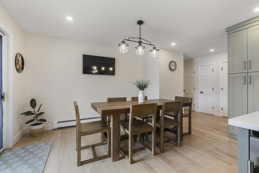 5 Crestwood Road North Reading, MA 01864 - Photo 10 of 40 a view of a dining room with furniture and wooden floor