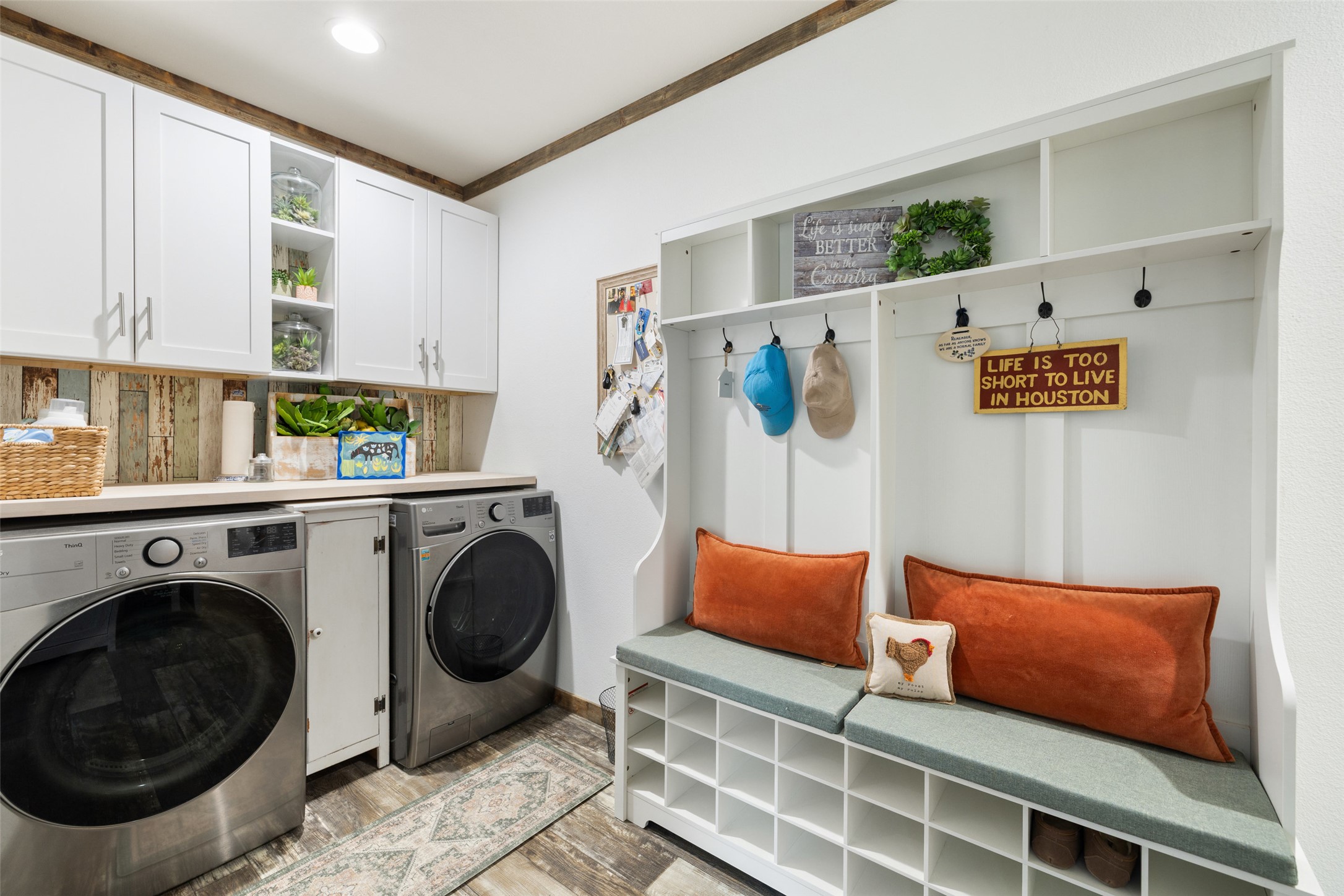 830 Ulrich Road Johnson City, TX 78636 - Photo 40 of 40 Functional laundry room offers built-in cabinetry, a convenient folding counter, and practical storage solutions.
