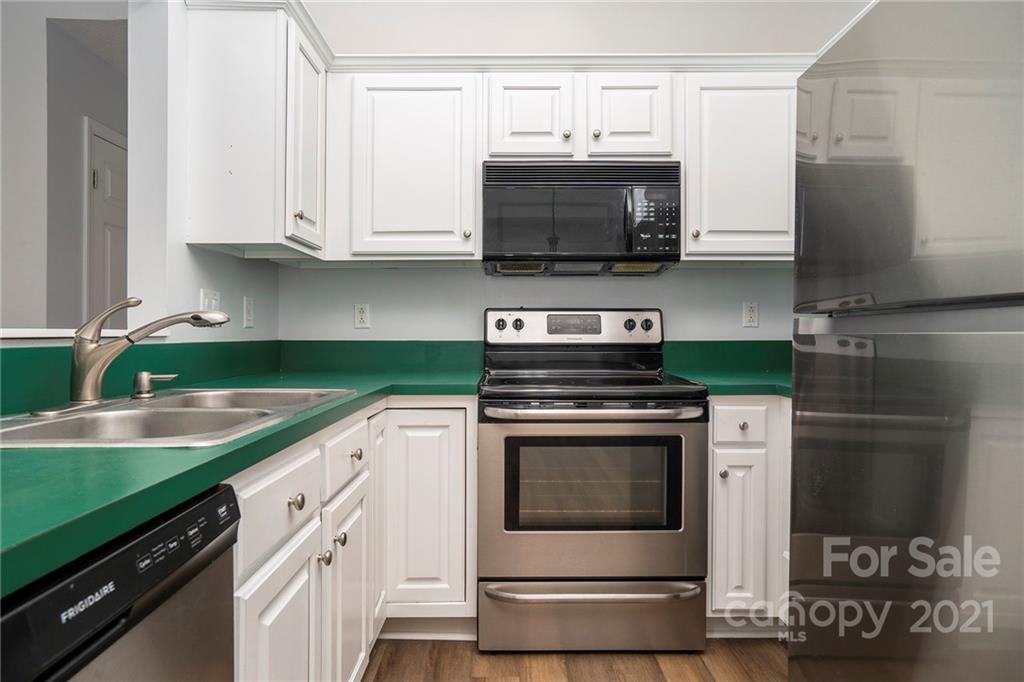 2432 River Chase Drive Monroe, NC 28110 - Photo 2 of 18 a kitchen with stainless steel appliances granite countertop a stove and a microwave