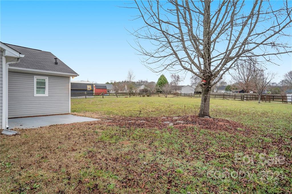 2432 River Chase Drive Monroe, NC 28110 - Photo 13 of 18 a backyard of a house with a yard and outdoor seating