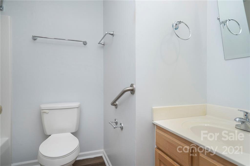 2432 River Chase Drive Monroe, NC 28110 - Photo 14 of 18 a white toilet sitting next to a bath tub