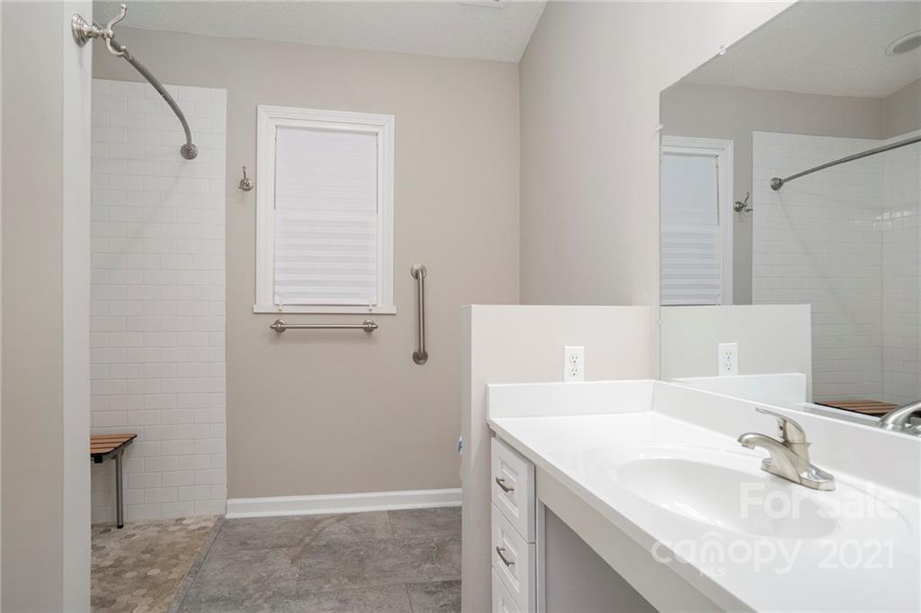 2432 River Chase Drive Monroe, NC 28110 - Photo 4 of 18 a bathroom with a sink and a mirror