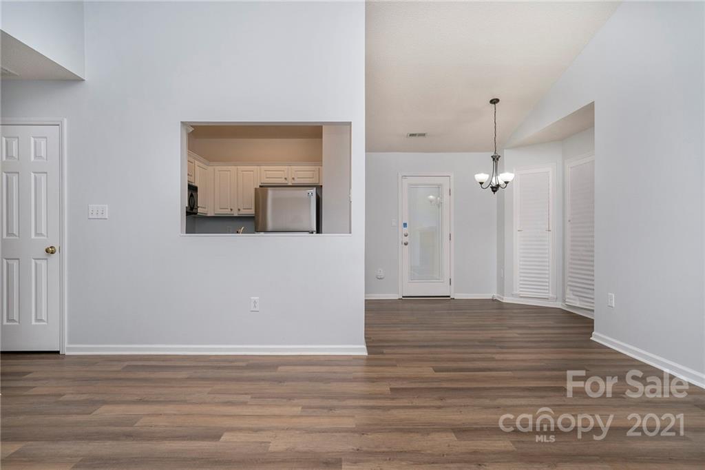 2432 River Chase Drive Monroe, NC 28110 - Photo 8 of 18 a view of a room with wooden floor and mirror