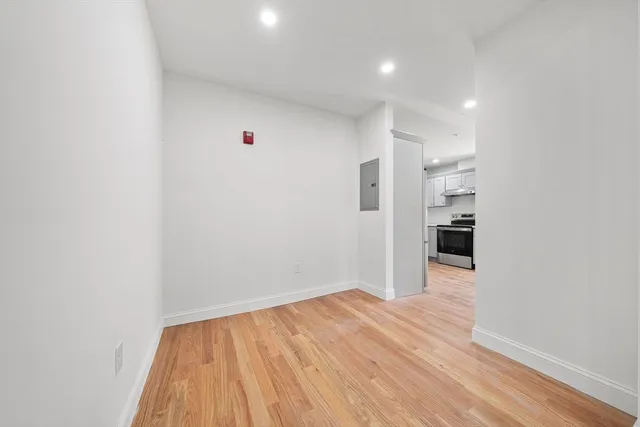 a view of a room with wooden floor and stairs