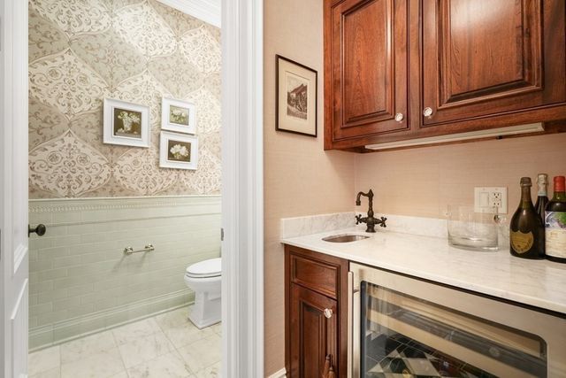 a bathroom with a sink a toilet and vanity