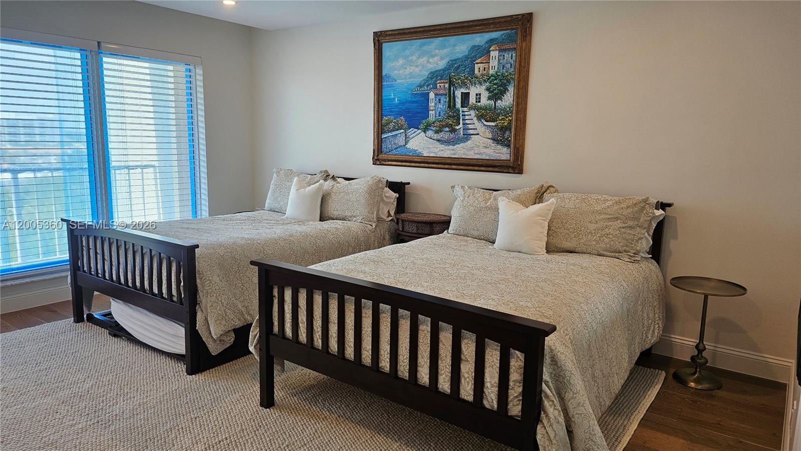 4001 North Ocean Boulevard, Unit 702 Boca Raton, FL 33431 - Photo 24 of 56 a bedroom with a bed and a painting on the wall