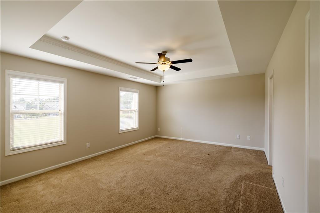 221 Winterset Circle Hoschton, GA 30548 - Photo 12 of 23 a view of an empty room with a window