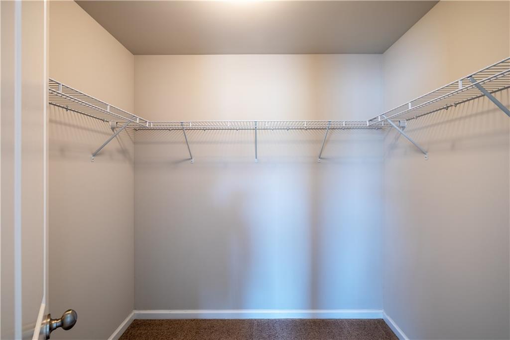 221 Winterset Circle Hoschton, GA 30548 - Photo 14 of 23 a view of small space with racks on the wall