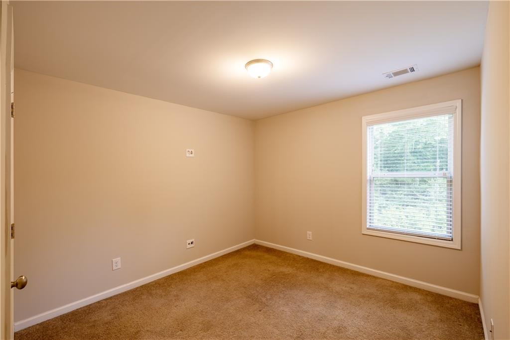221 Winterset Circle Hoschton, GA 30548 - Photo 20 of 23 an empty room with a window