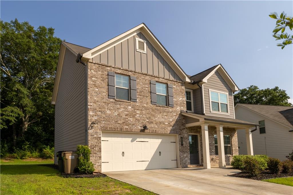 221 Winterset Circle Hoschton, GA 30548 - Photo 2 of 23 a view of a house with a yard