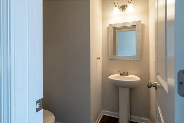a bathroom with a sink and mirror