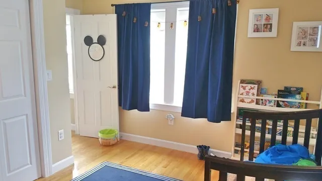 a view of an entryway and wooden floor