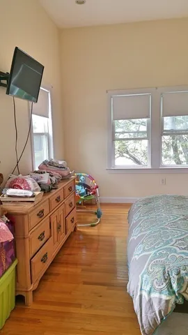 a bed room with a bed and a window