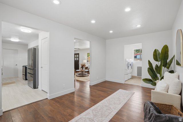6889 South Village Road Salt Lake City, UT 84121 - Photo 3 of 44 Open concept interior featuring dark wood-finish flooring, recessed lighting, could be used as a den.