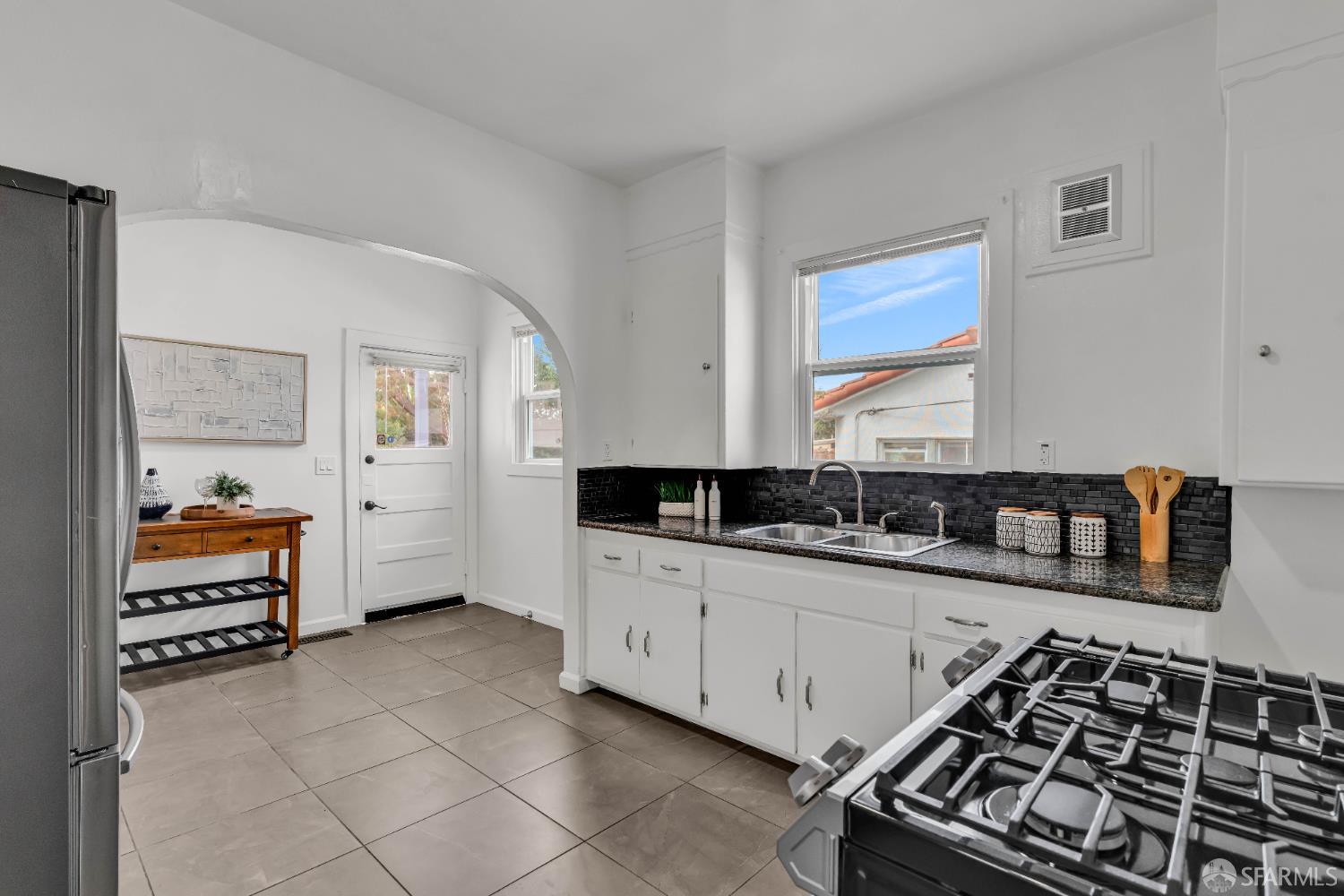 2918 Newbury Street Berkeley, CA 94703 - Photo 16 of 42 a kitchen with a sink and a stove top oven
