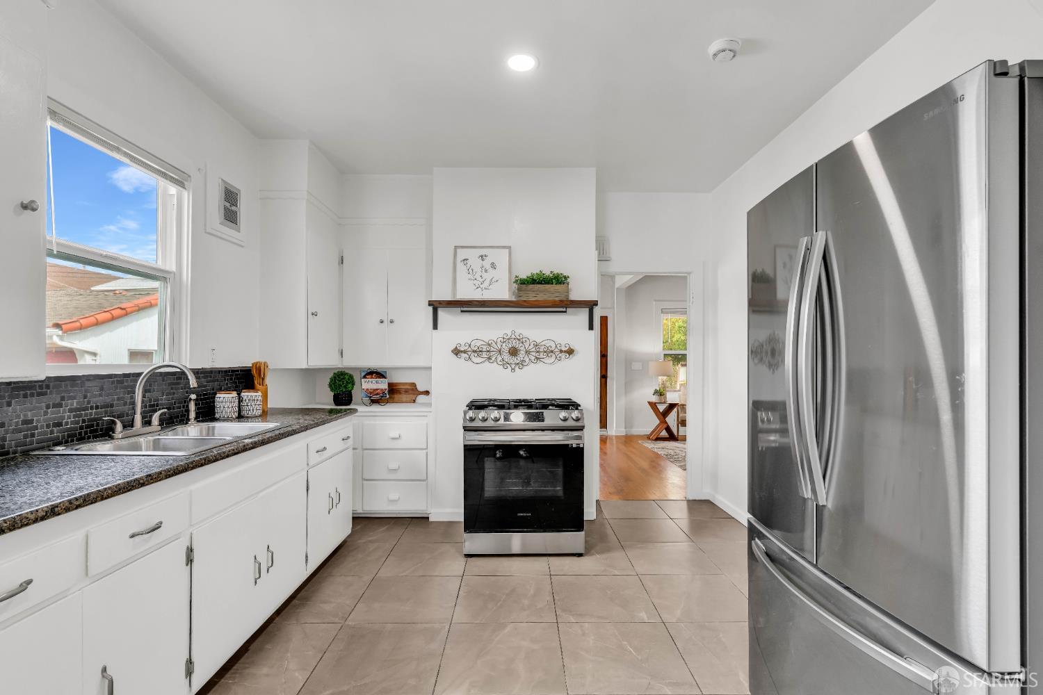 2918 Newbury Street Berkeley, CA 94703 - Photo 18 of 42 a kitchen with stainless steel appliances granite countertop a refrigerator a stove and a sink