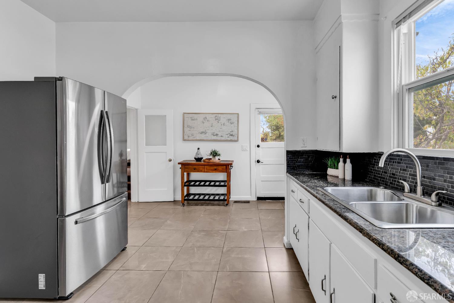 2918 Newbury Street Berkeley, CA 94703 - Photo 21 of 42 a kitchen with a refrigerator sink and stove