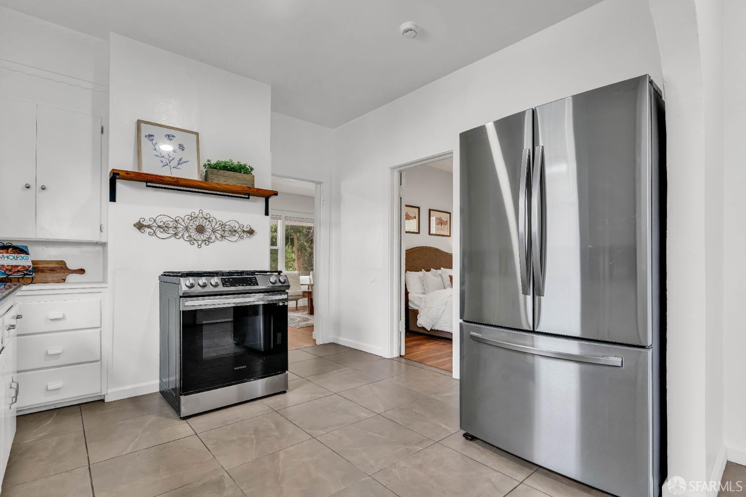 2918 Newbury Street Berkeley, CA 94703 - Photo 22 of 42 a kitchen with stainless steel appliances granite countertop a refrigerator and a stove