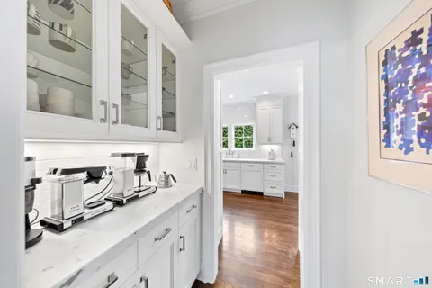 a kitchen with sink cabinets and a window