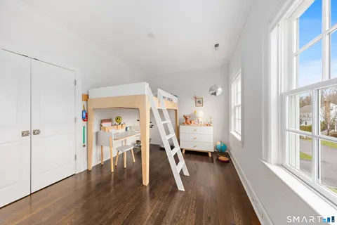 a view of entryway with livingroom and wooden floor