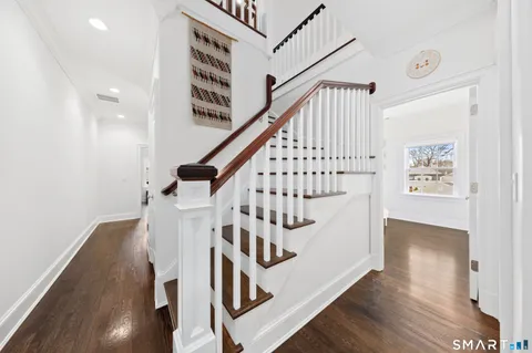 a view of entryway with wooden floor
