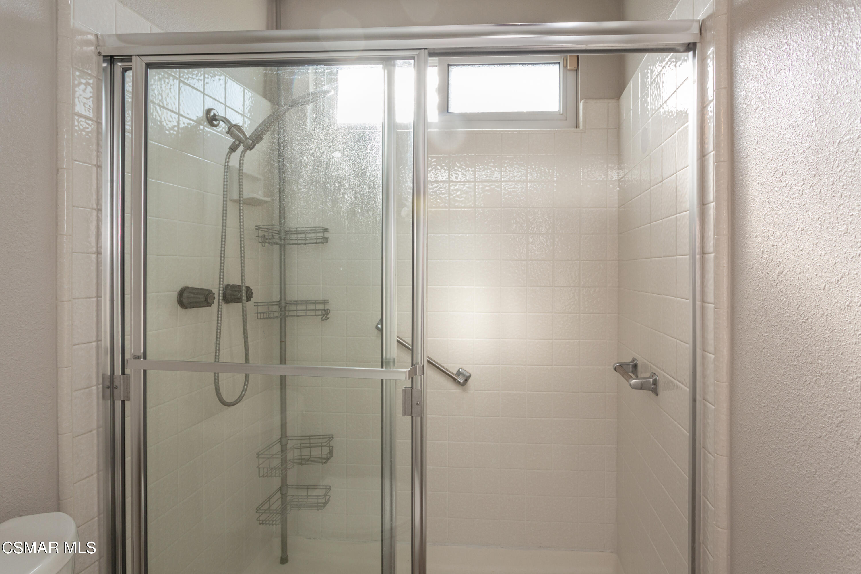 4249 Laurelhurst Road Moorpark, CA 93021 - Photo 18 of 30 a bathroom with a glass shower door